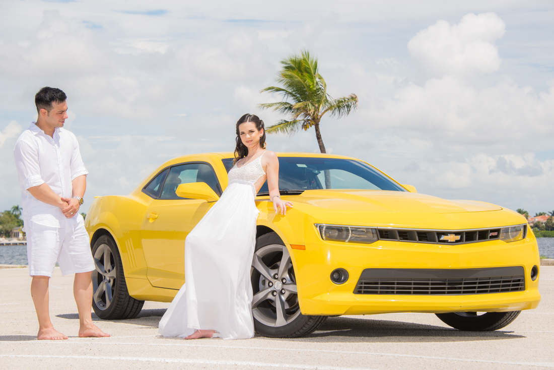 engagement couple and their camaro race car