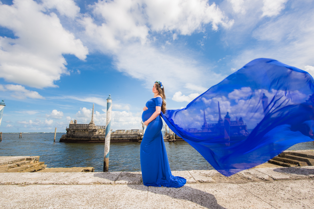 maternity photo blue dress floating on air at Vizcaya museum miami