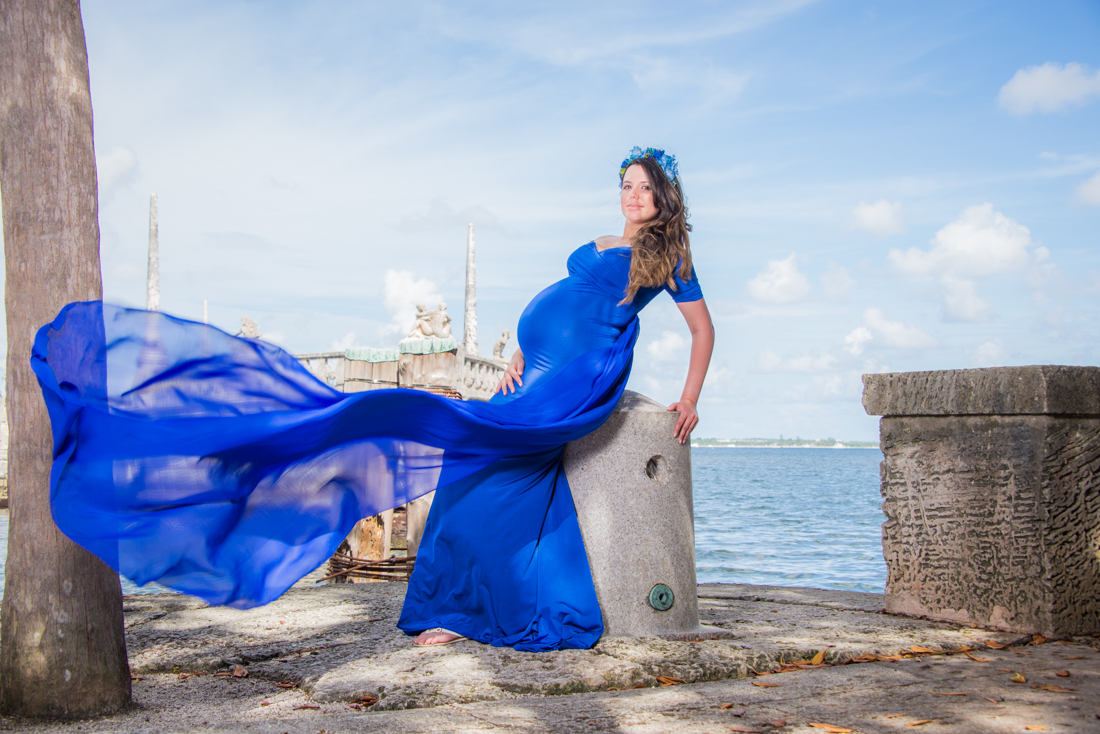pregnancy picture blue dress flying around beach background Vizcaya museum miami